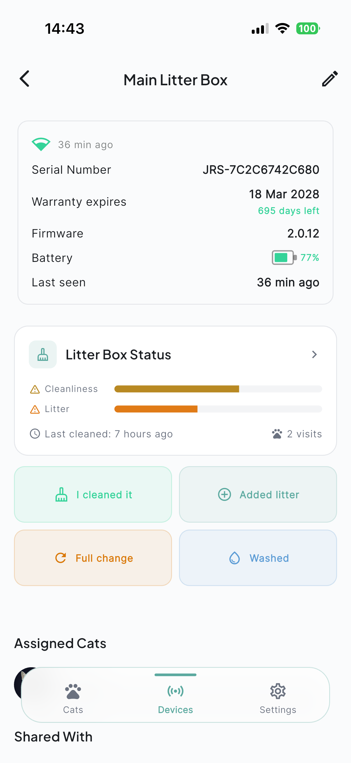 Device detail screen showing battery at 77%, firmware version, warranty status, and litter box actions.